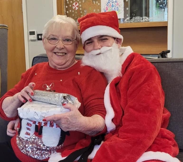 Santa visiting our residents with gifts at Ty Llandaff Care Home