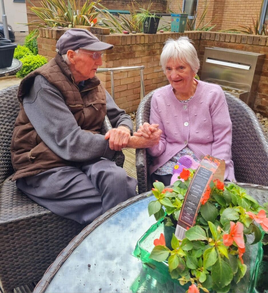 Our residents with plants at our gardening club at Ty Llandaff Care Home
