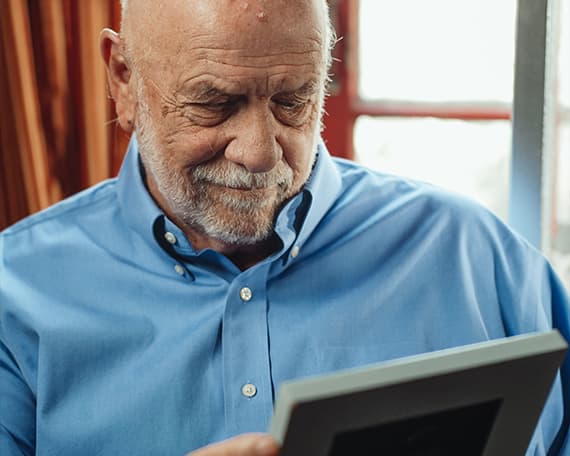 A resident looking at a photo