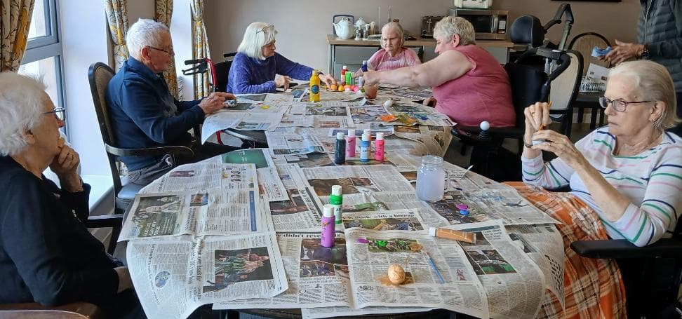 older adults doing arts and crafts