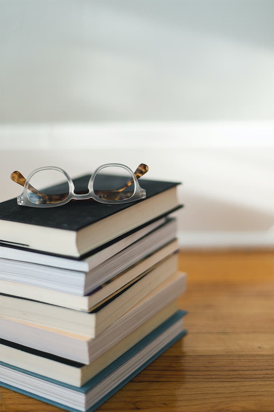 Glasses on Stack of Books