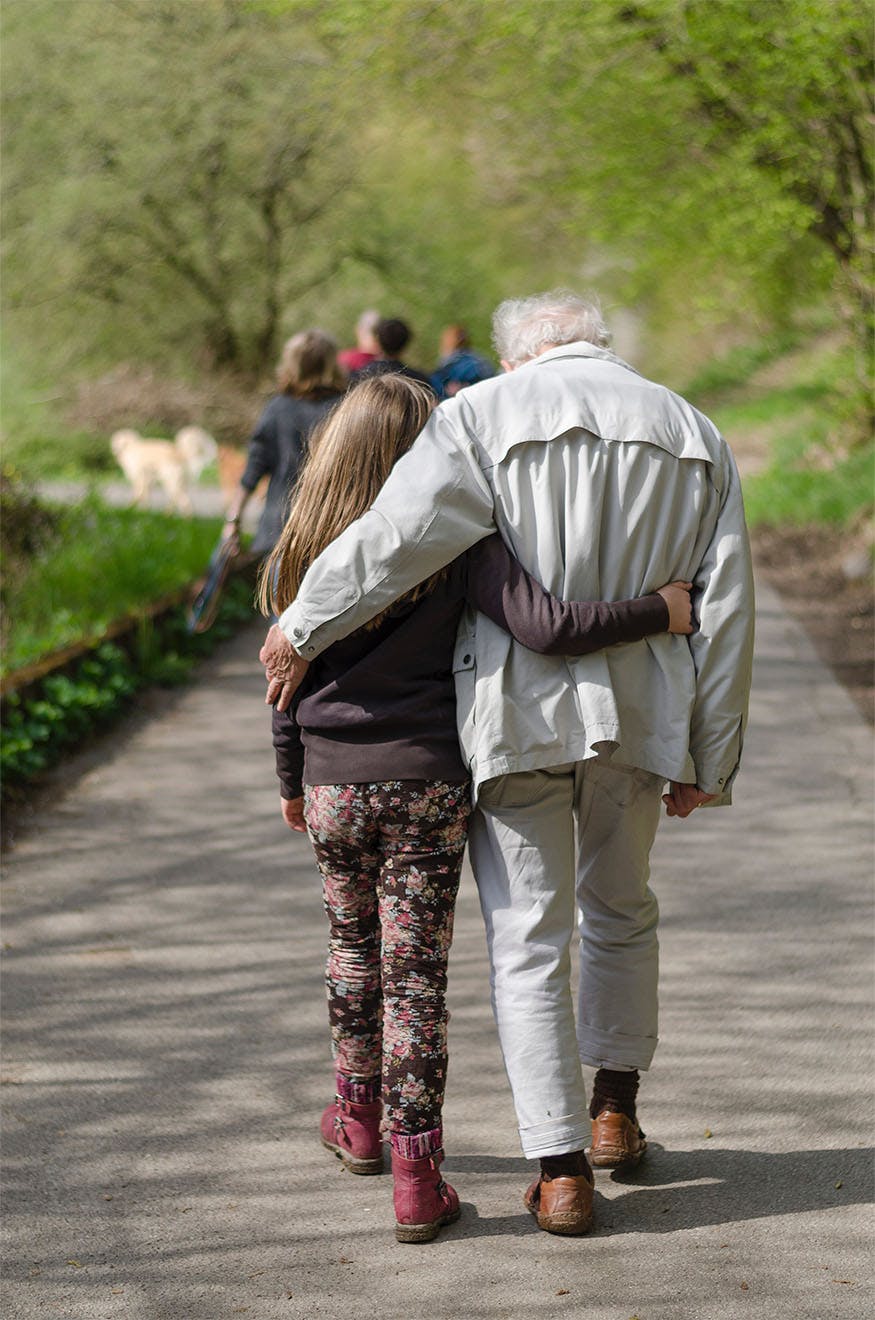 A resident walking with granddaughter