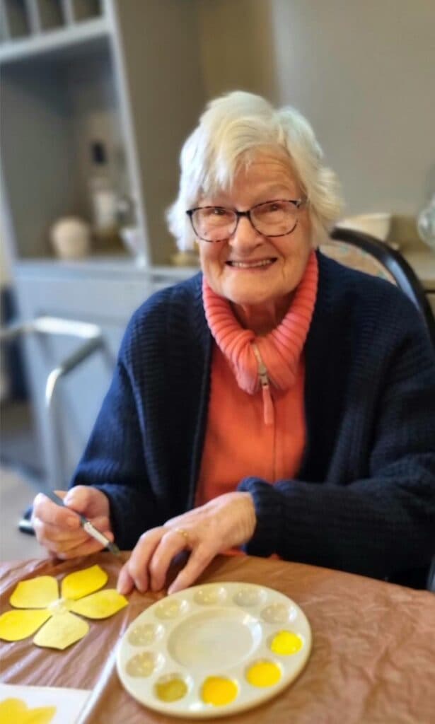 resident doing arts and crafts