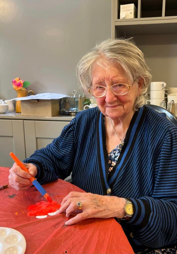 resident doing arts and crafts