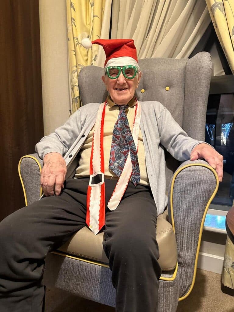resident in christmas outfit