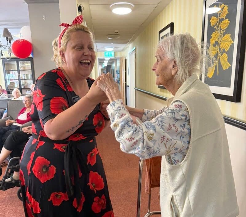 one of our residents dancing with a team member
