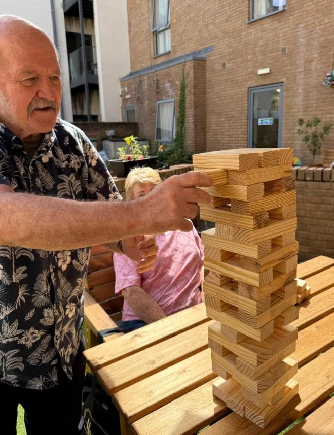 resident-playing-jenga