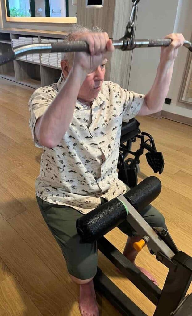 resident using the lat pulldown within the home