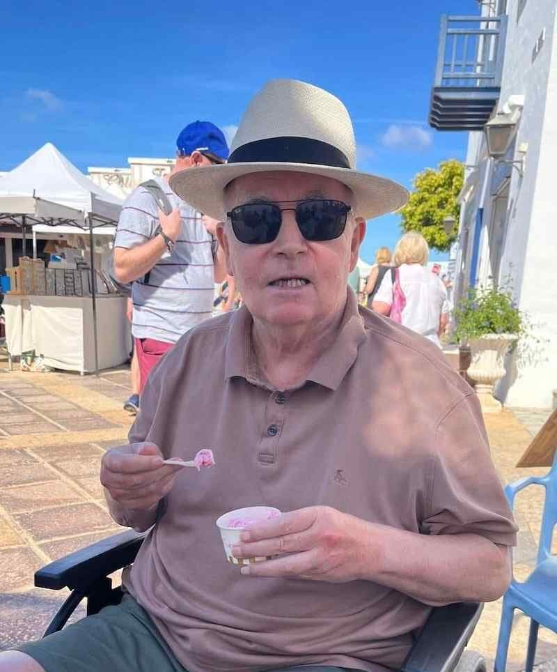resident wearing a pink top with ice cream in a tub